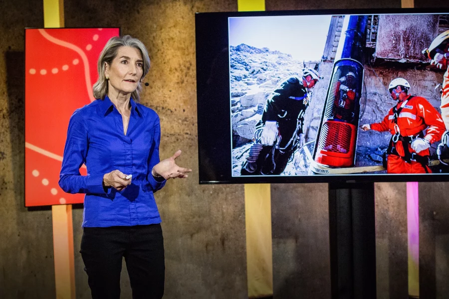 Screenshot of Amy Edmondson's TED Talk on psychological safety, showing her speaking on stage beside a television.