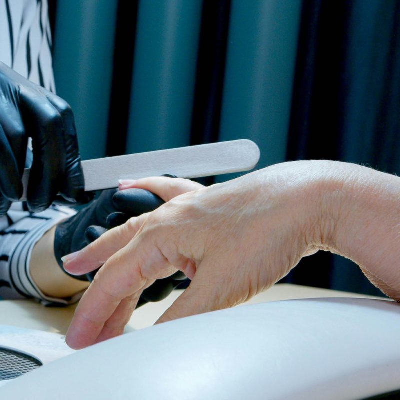 Image of nail technician giving a manicure