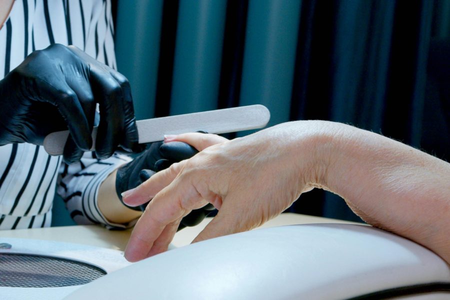 Image of nail technician giving a manicure