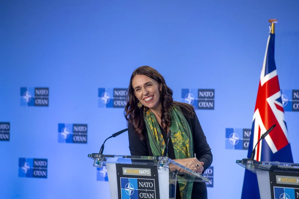 Former New Zealand Prime Minister Jacinda Ardern stood at a podium