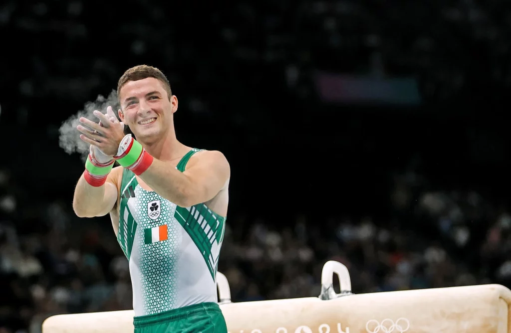 Olympian Rhys McClenaghan clapping after his event at the Paris 2024 Olympics