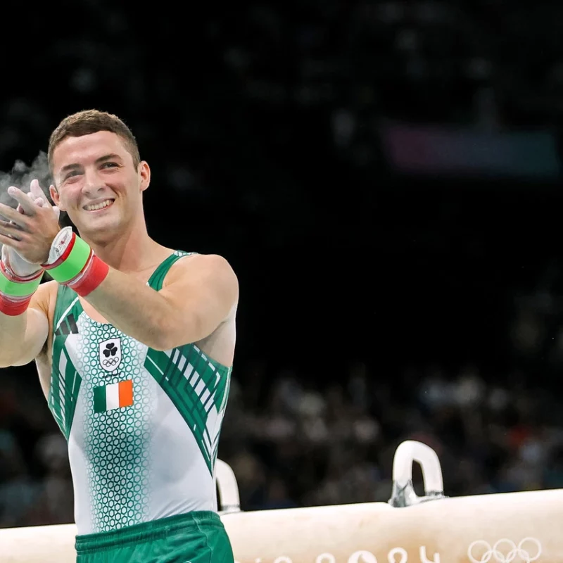 Olympian Rhys McClenaghan clapping after his event at the Paris 2024 Olympics