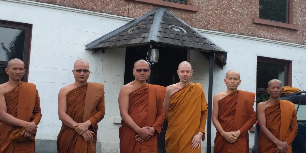 Monks stood in front of the Sunyata Centre